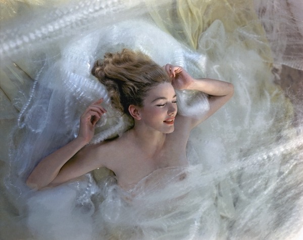 Sleeping model, Susann Shaw, partially covered in white lace bedding *** Local Caption *** Susann Shaw; Vogue November 01, 1940 Beauty